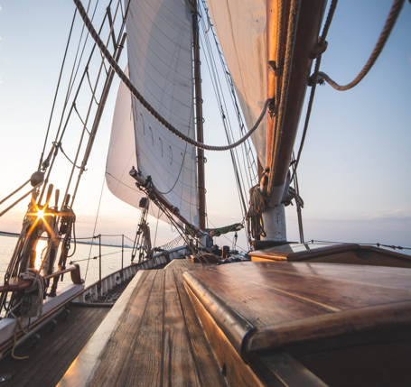 close-up of the deck of a wooden boat under sunset